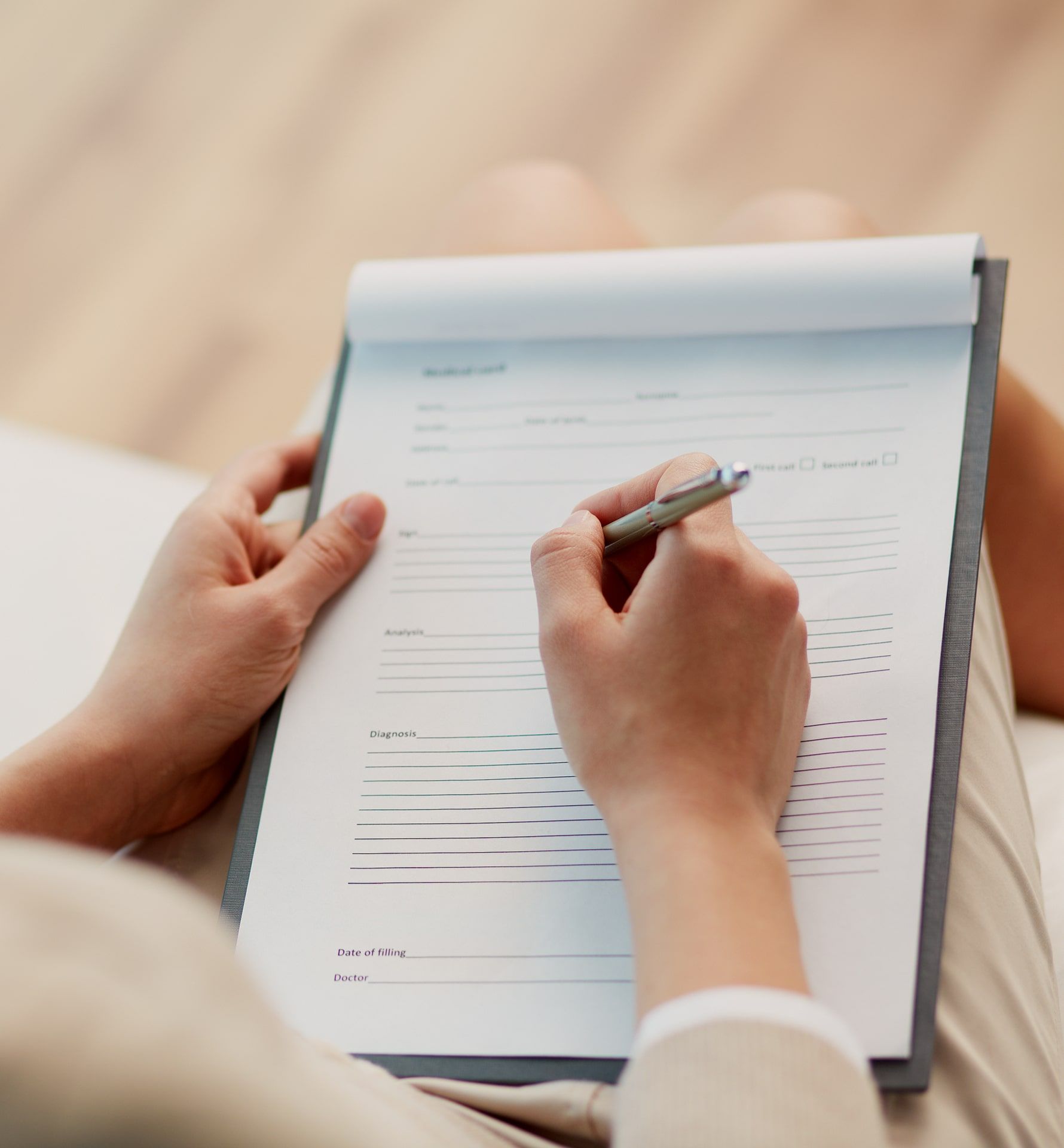 Female counselor writing down some information about her patient