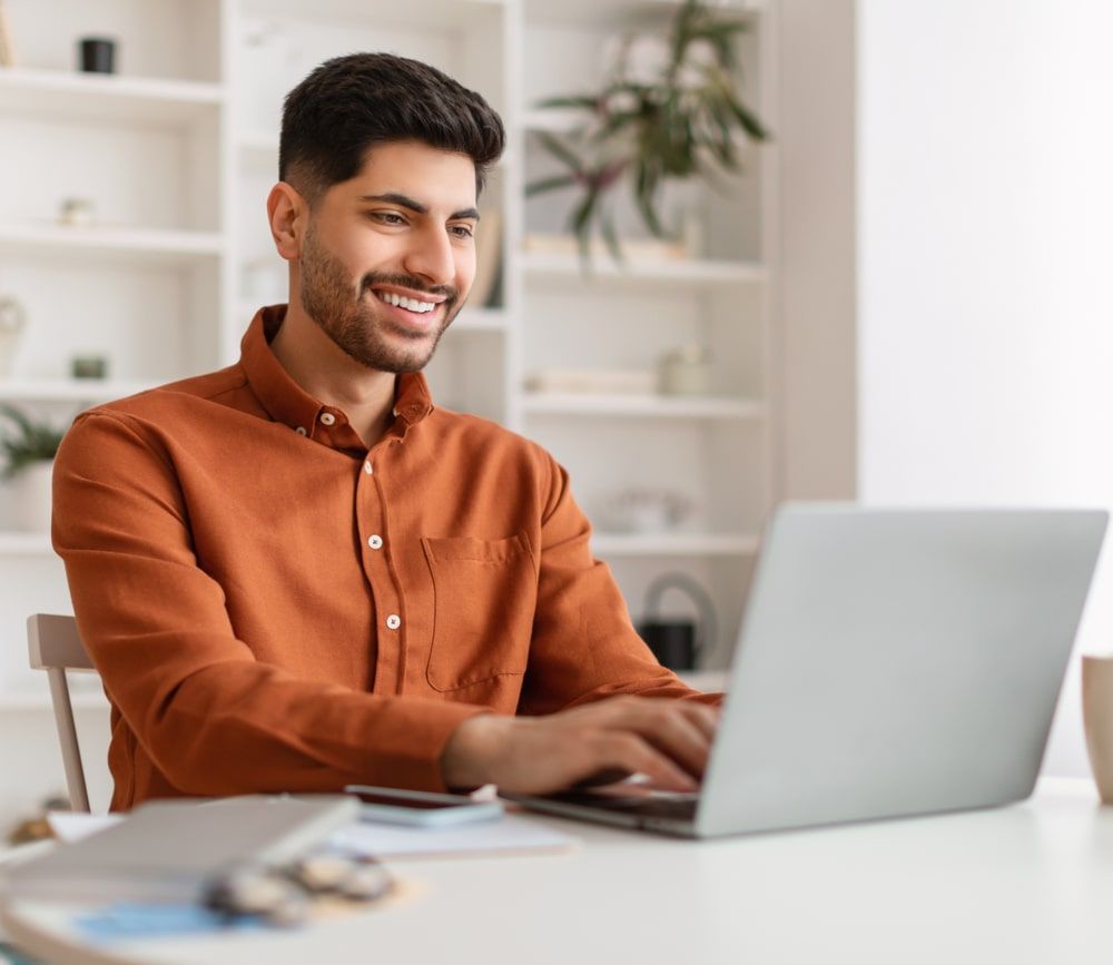 Male Manager Working On Laptop