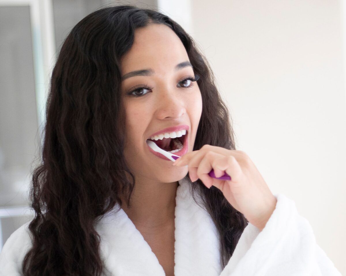 Woman brushing her teeth