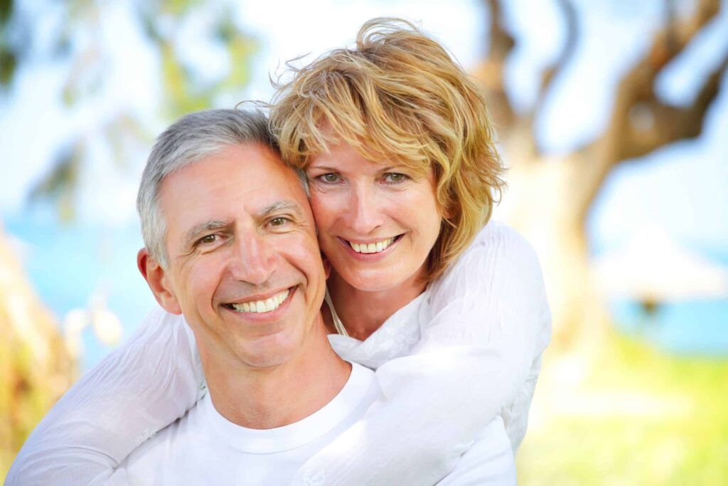 mature couple smiling and embracing