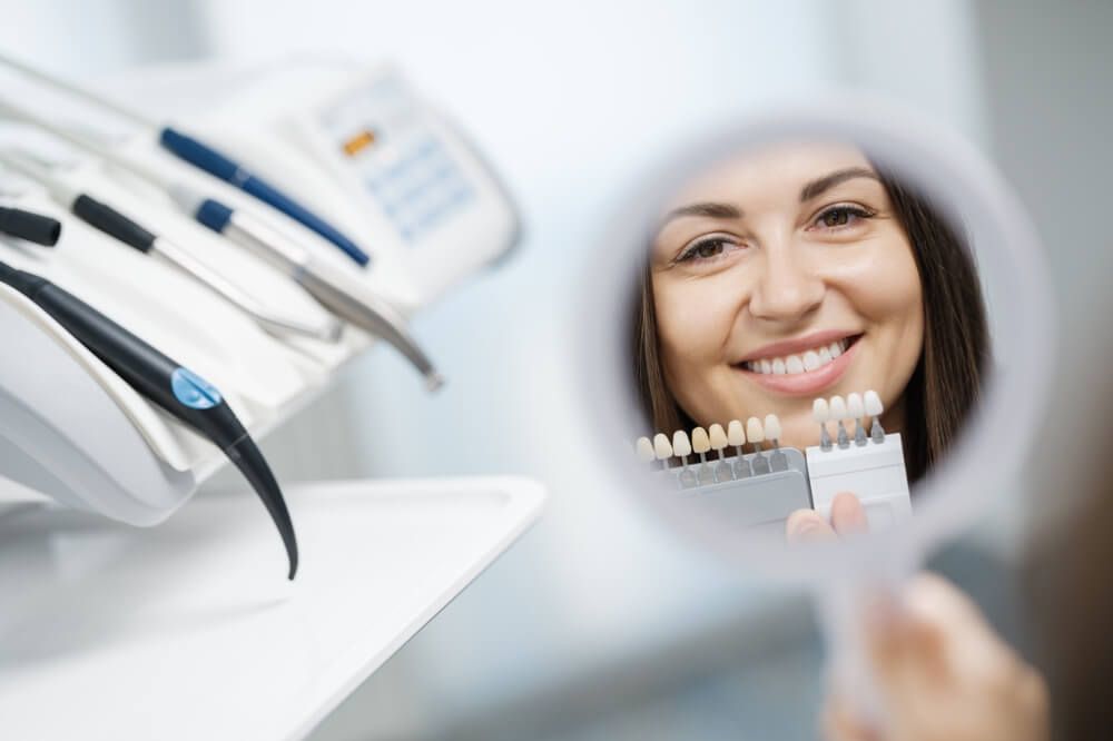 Cheerful young girl is visiting dental clinic