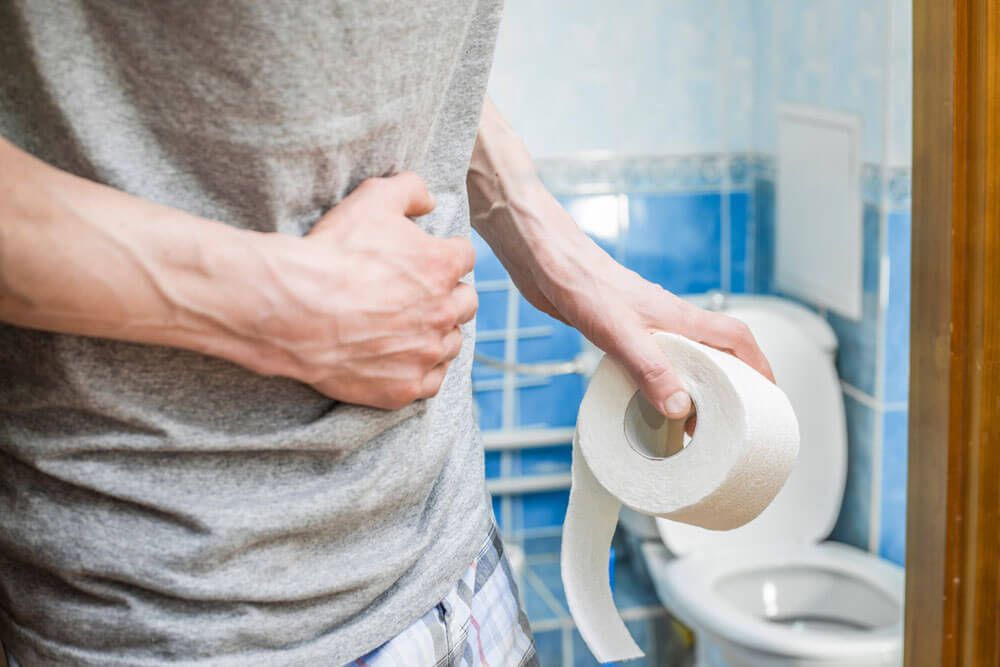 Abdominal pain in a man in the toilet