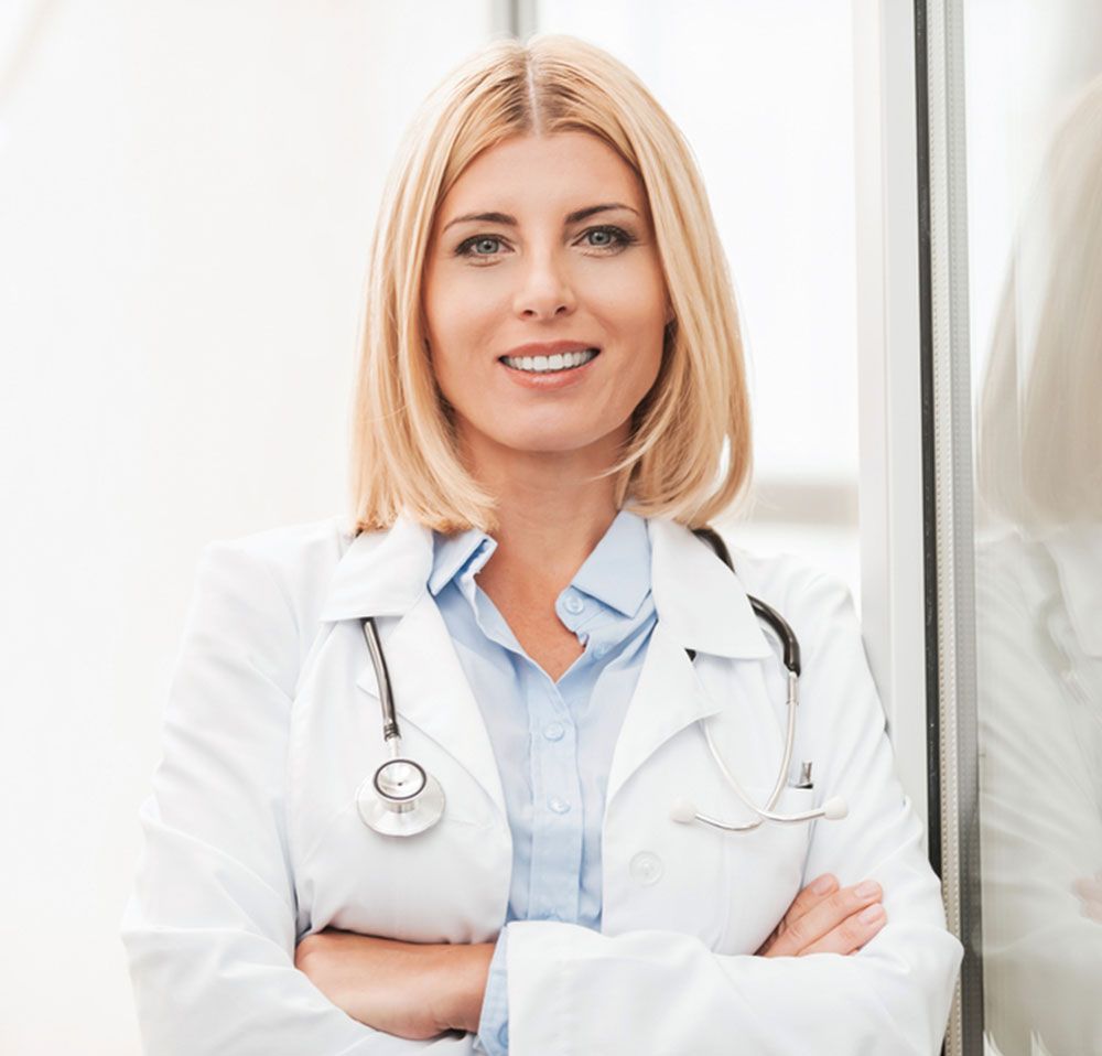 Confident female doctor in white uniform