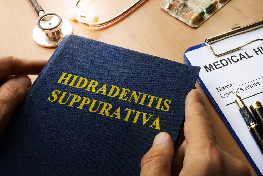 Book with title Hidradenitis Suppurativa on a table