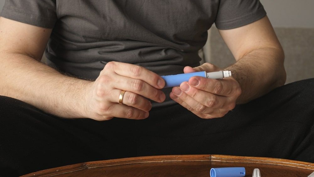 Man preparing Semaglutide Ozempic injection
