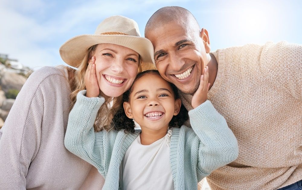 Family, smile and face portrait in nature on holiday