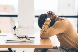 Man resting between work due to darkness of sight