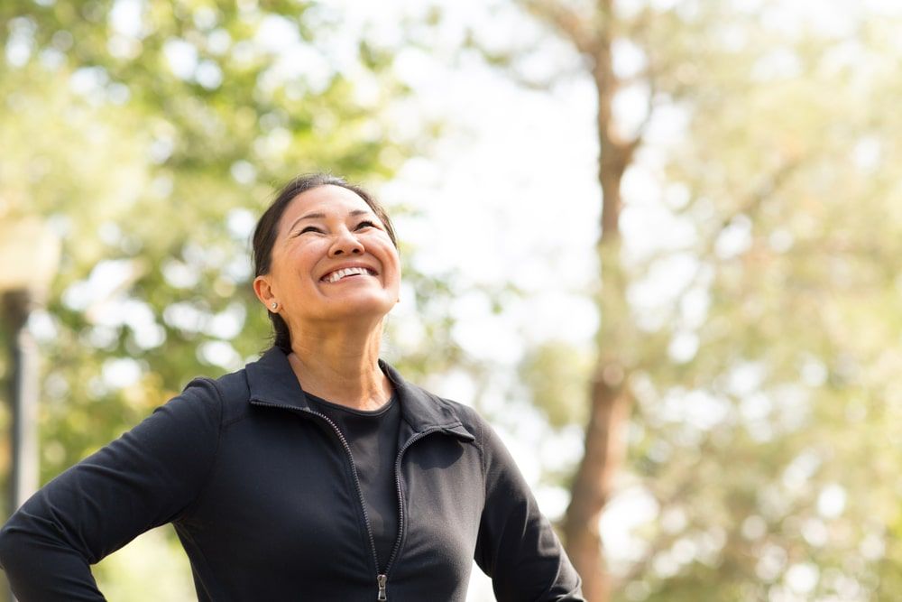 Fit woman exercising and walking outside