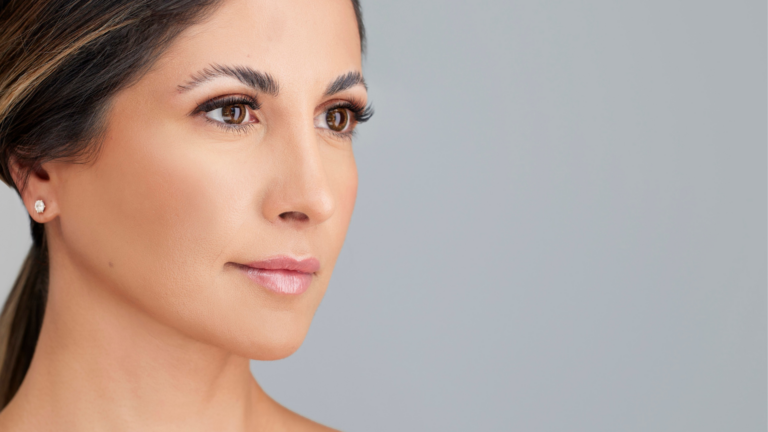 Woman looking off in the distance after a facial at The IO Clinic