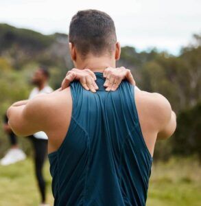 sports man with neck pain in exercise