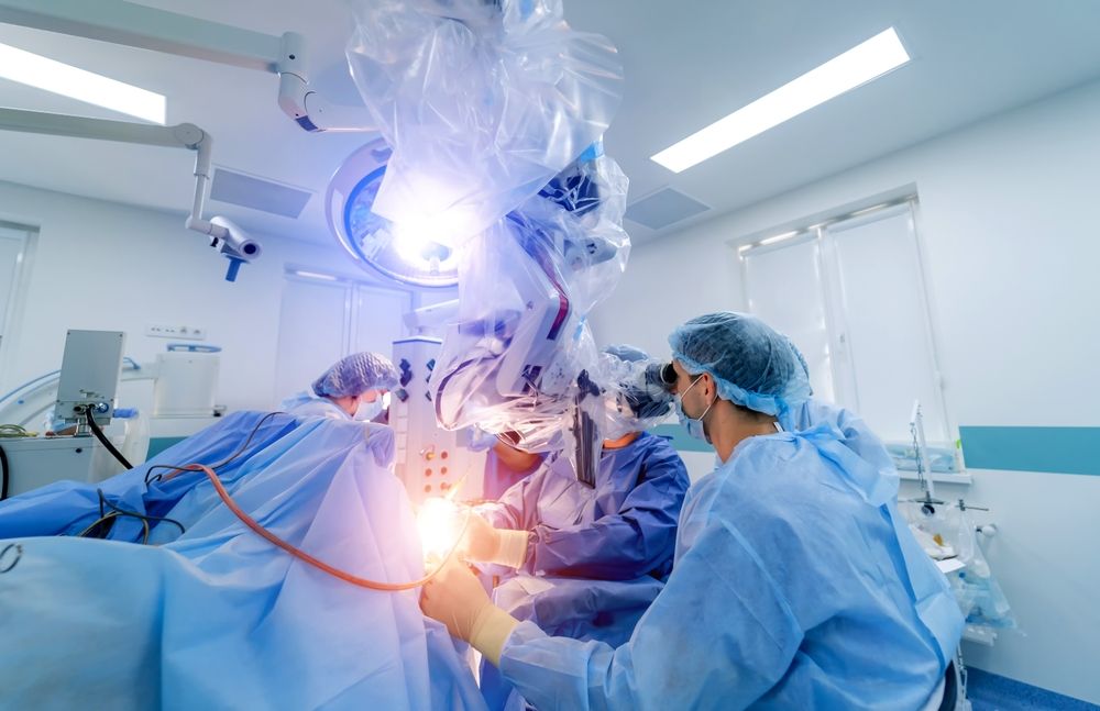 Robotic equipment in modern neurosurgery clinic. Team of neurosurgeons providing operation. Selective focus. Closeup.