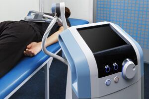 Electromagnetic therapy session with medical device applied to patient's back