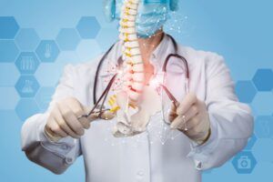 The concept of surgical treatment of the spine. Doctor produces manipulation of the spine.