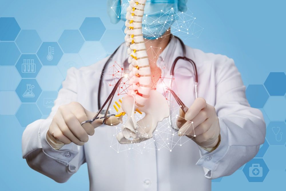 The concept of surgical treatment of the spine. Doctor produces manipulation of the spine.