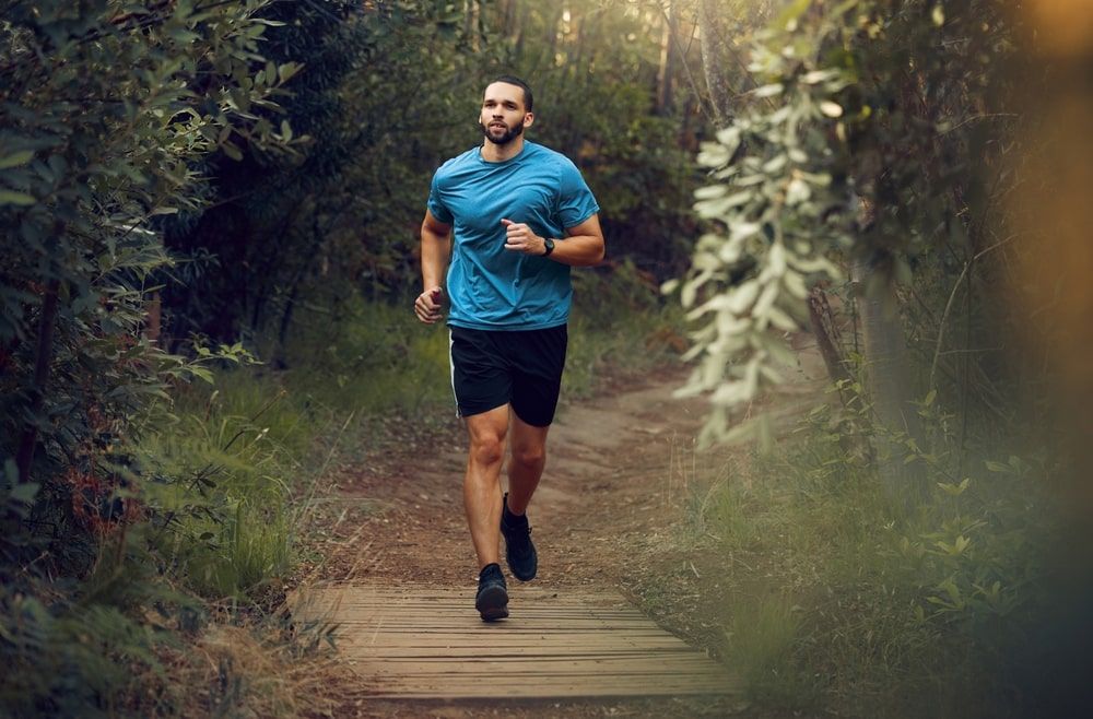 Man and running in nature for healthy exercise