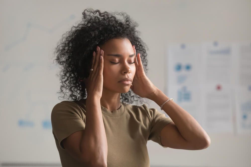 Exhausted woman suffer from headache