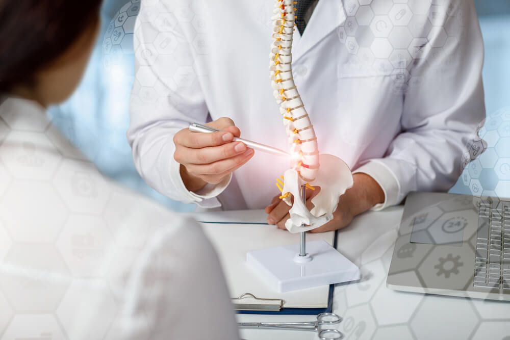 Doctor advising patient about problem areas of the spine