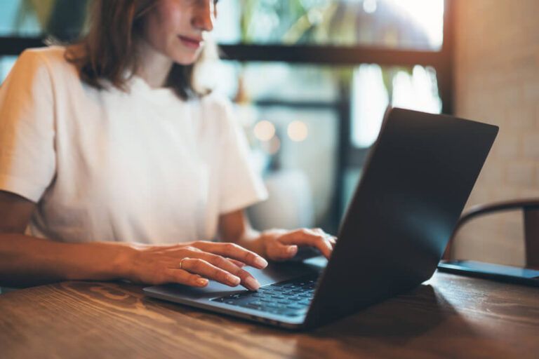 girl writing on keyboard at office