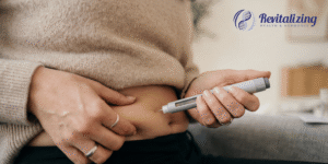 A healthcare provider discussing the latest research on semaglutide and healthy aging alongside a headline reading, "Could Your Weight Loss Medication Also Be Slowing the Aging Process?" The image promotes a Revitalizing Health & Hormones blog exploring new research on GLP-1 medications, metabolic health, and longevity.