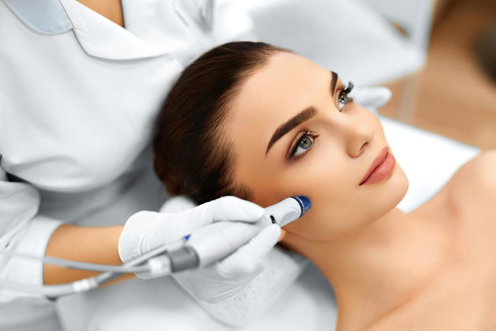 Face Skin Care. Close-up Of Woman Getting Facial Hydro Microdermabrasion Peeling Treatment