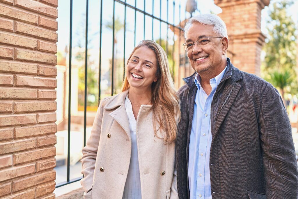Middle age man and woman couple smiling confident standing together