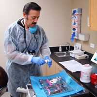 Dr. Edward Camacho working at clinic