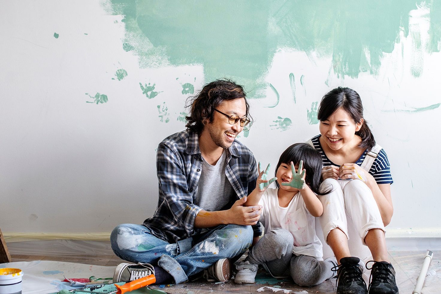 Young Asian Family Painting