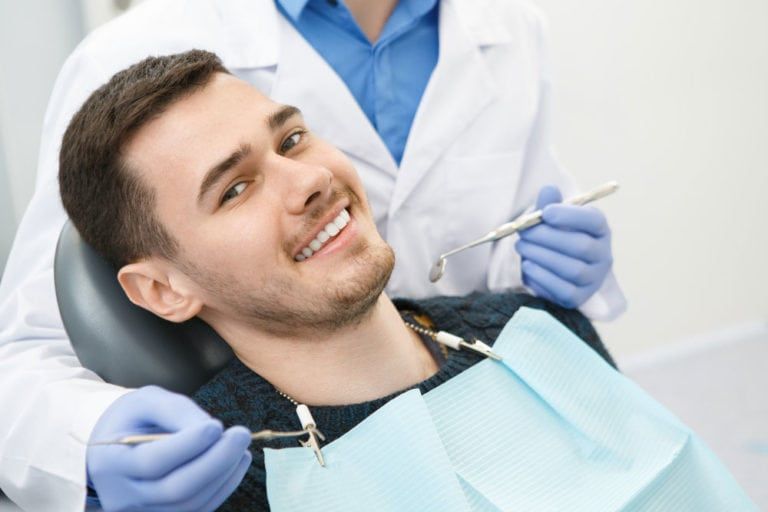 Young man having dental treatment