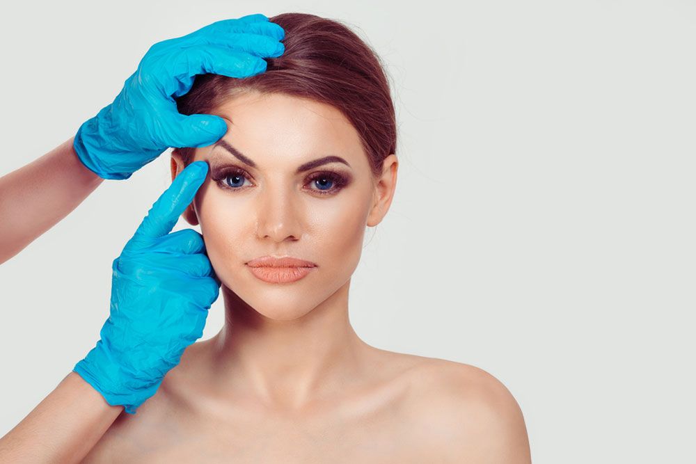 Beautiful middle age woman getting ready for eyelid lift plastic surgery