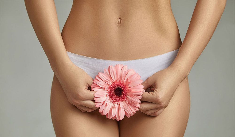 Woman in underwear with flower