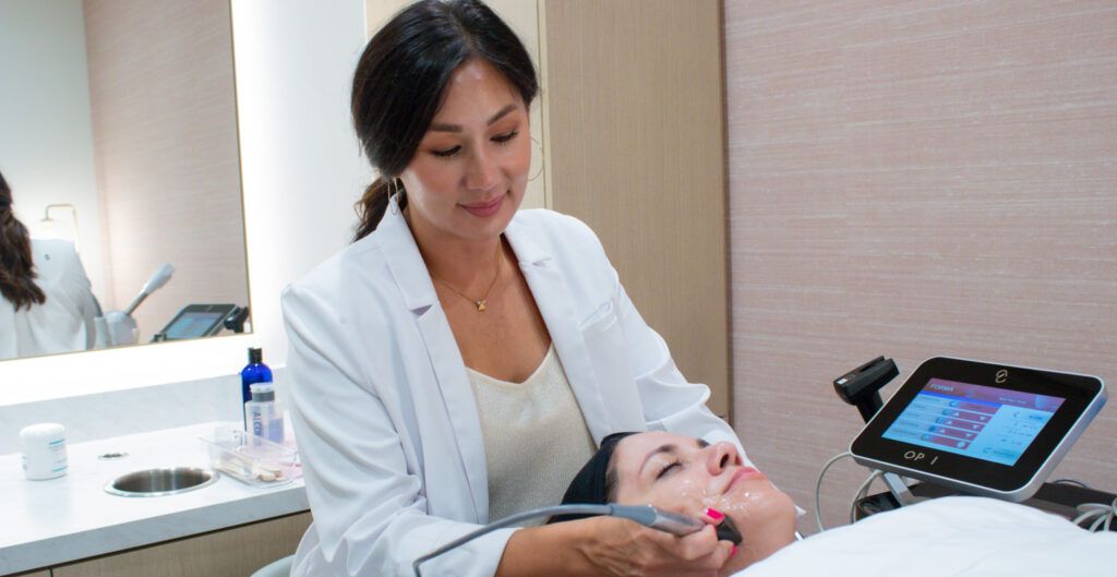 Microneedling machine being used on a woman