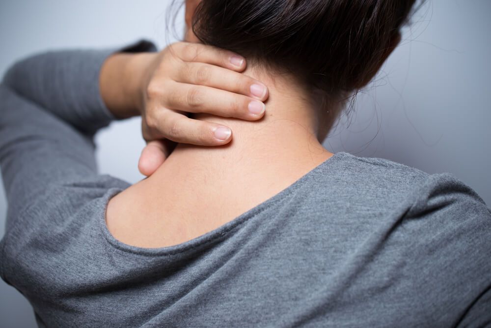 Woman has neck pain