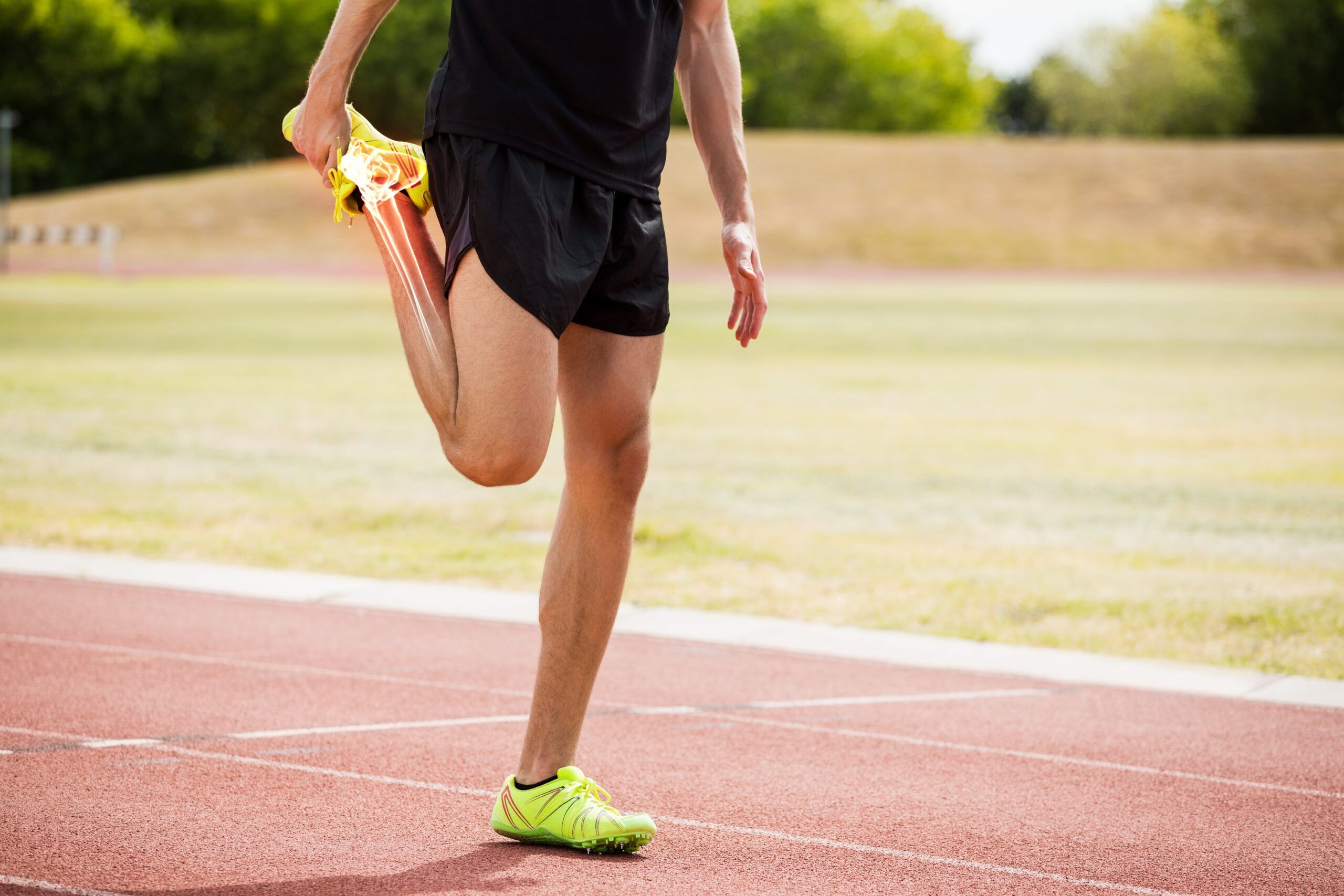 highlighted bones of athlete man stretching on race track