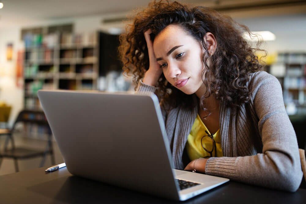 Student woman finding it difficult at study