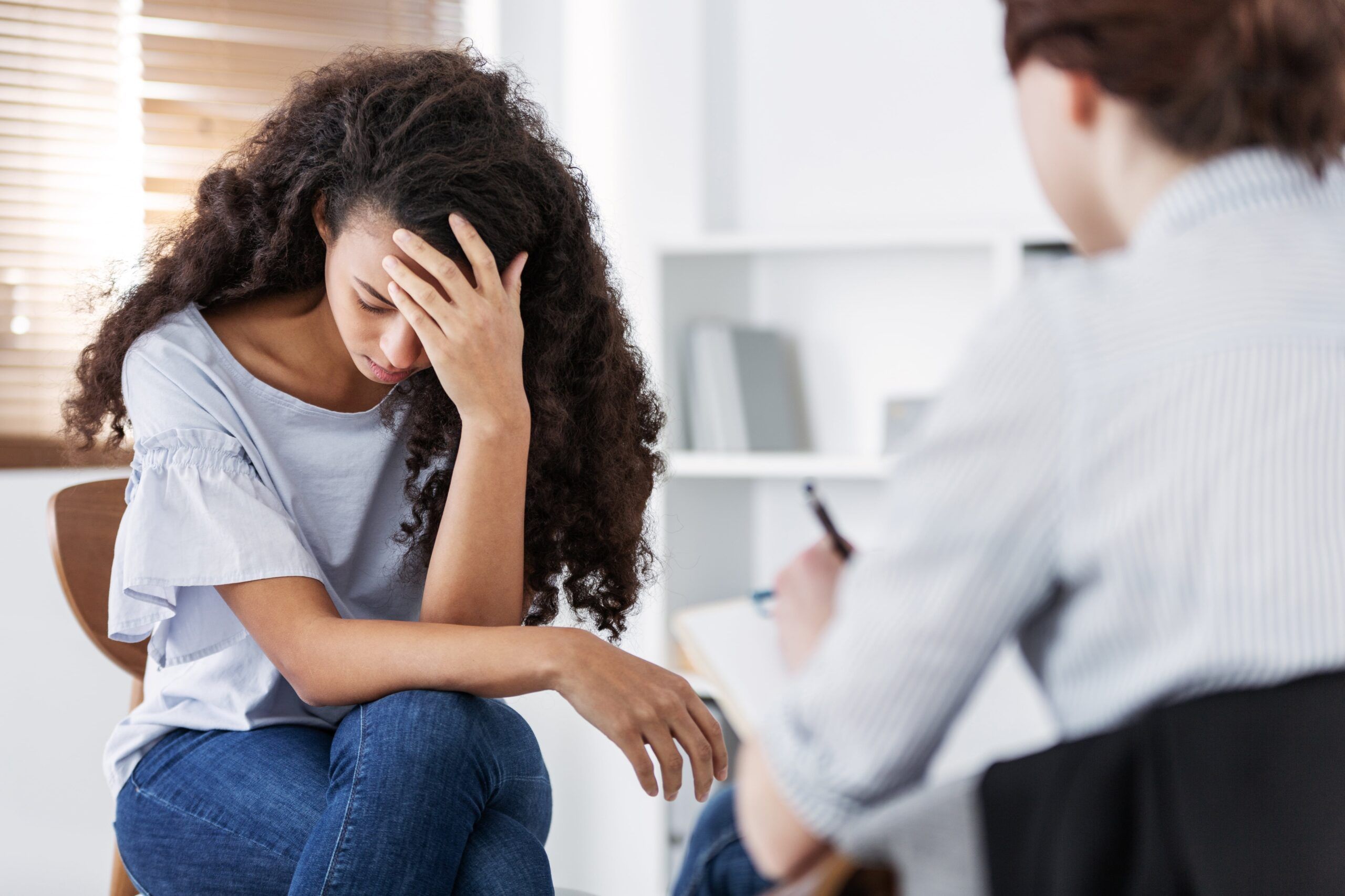 Distressed Young Woman with Therapist