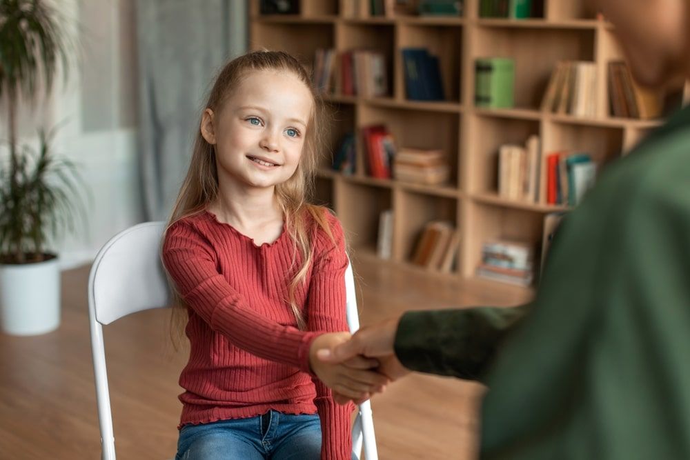 Pretty preschooler girl visiting psychotherapist