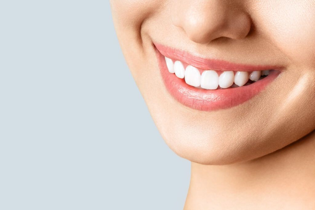 Beautiful female smile after teeth whitening procedure