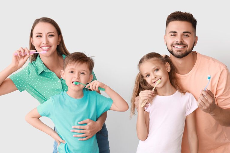 Happy family brushing teeth