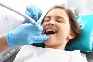 Child on the dental chair during surgery