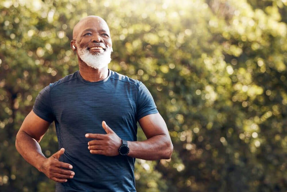 man running in park with music