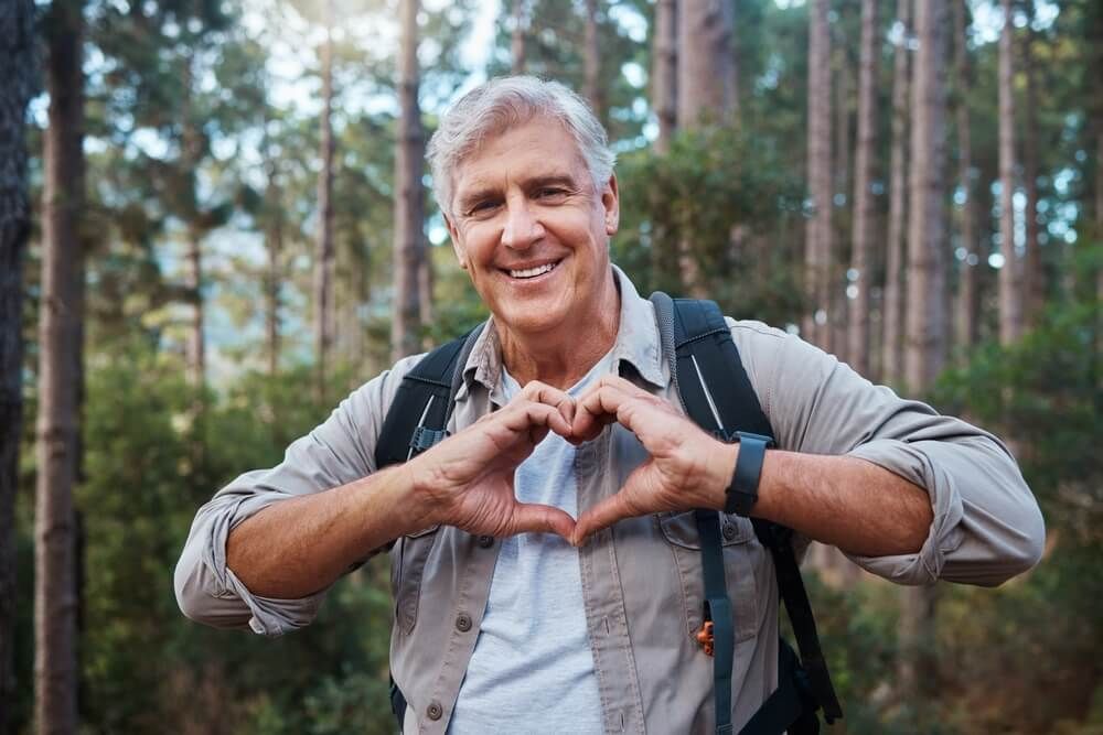 enior man in forest hiking