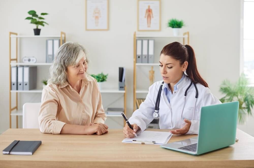 doctor discussing infectious disease management with patient