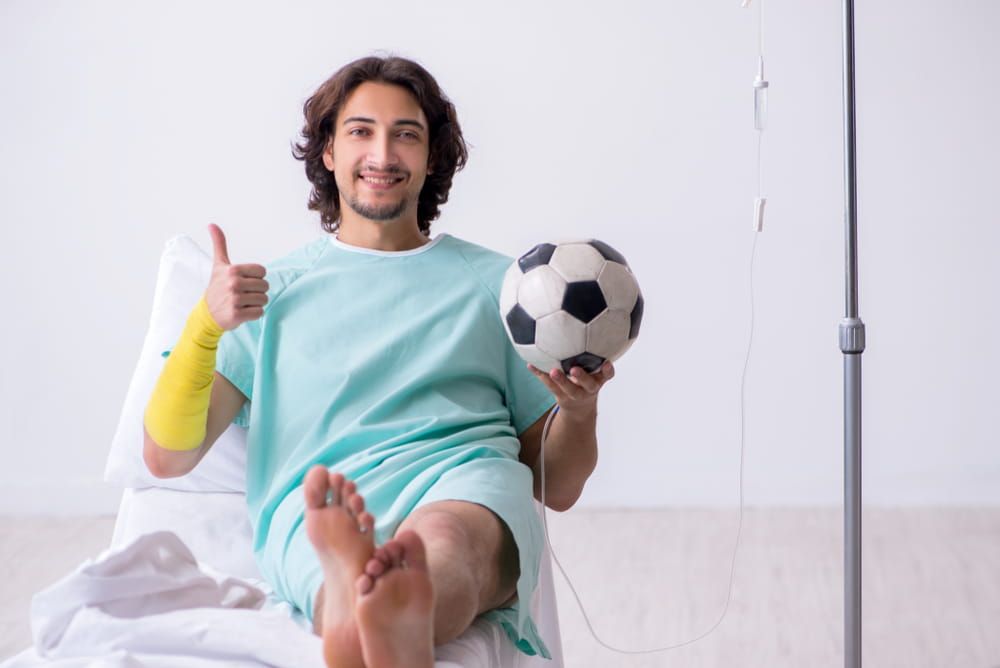 Young man staying in hospital in transfusion concept