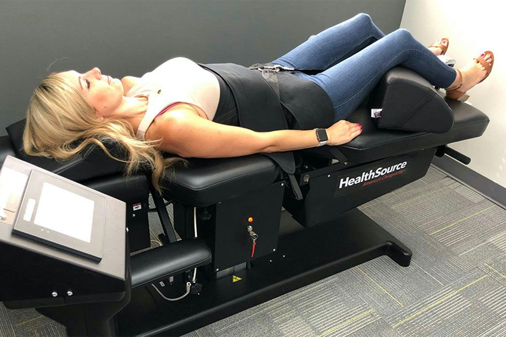 Woman getting Spinal Decompression therapy