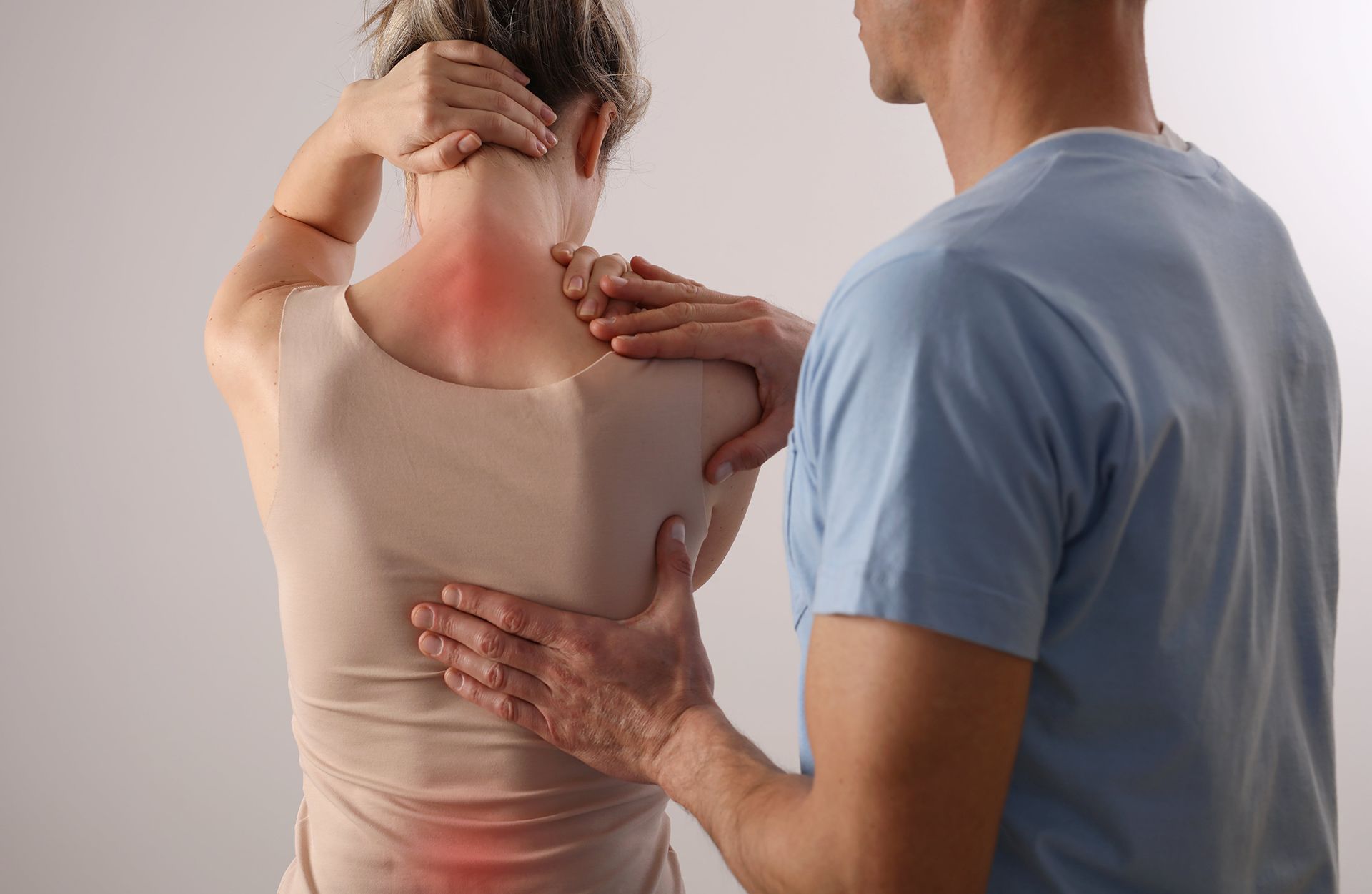 Spine physical therapist and patient with back pain