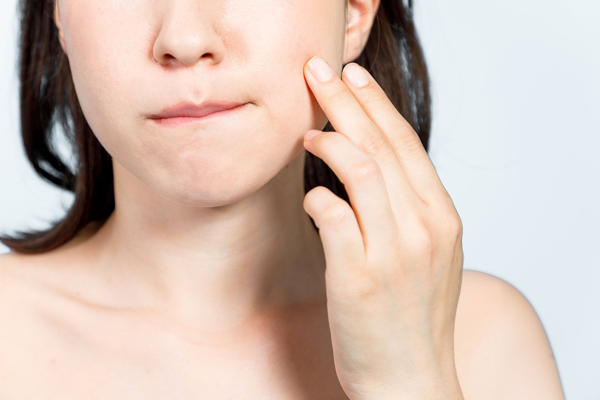 Young woman suffering from toothache