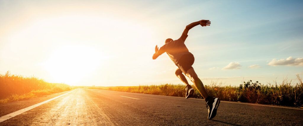 Athlete runner feet running on road