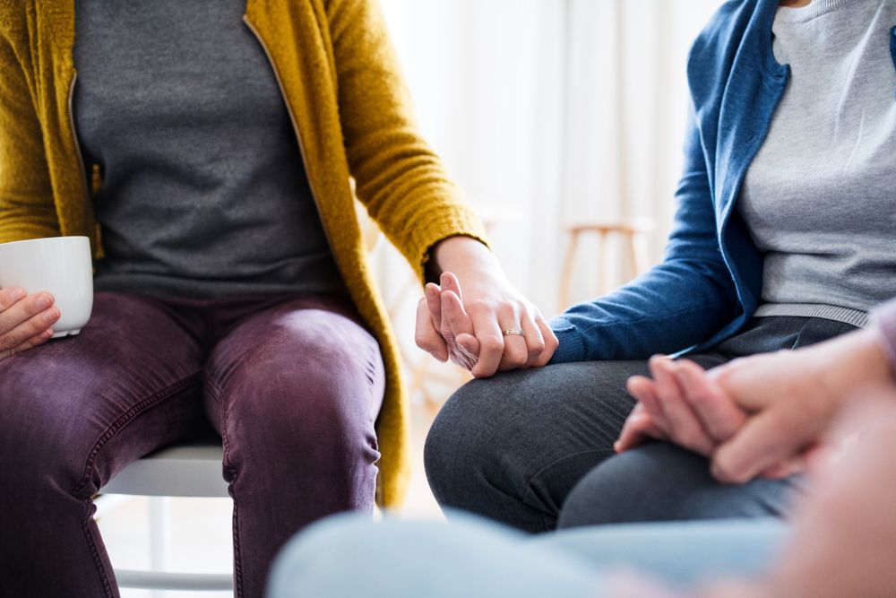 Person speaking with group about their Anxiety And Depression