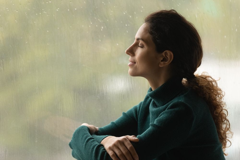 Woman smiling after receiving Stress Management tips 