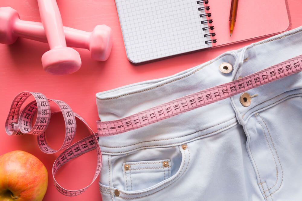 Measure tape with light blue jeans